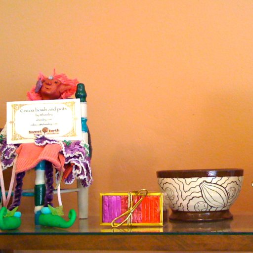 A fairy relaxes beside a cocoa bowl