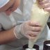Piping white chocolate mouse into the finished columns