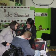 A man on wheel chair tasting all my chocs